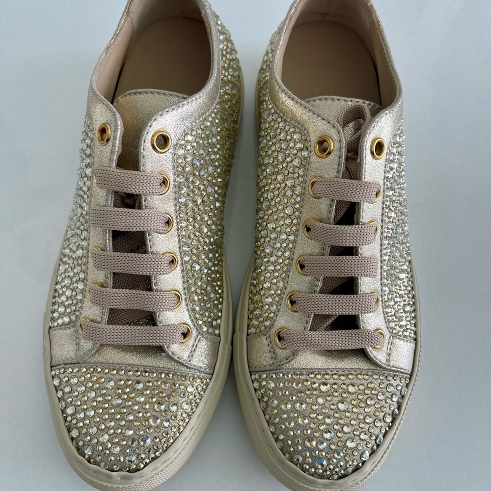Hand made in Italy. Gold leather with gold crystal embellishments.